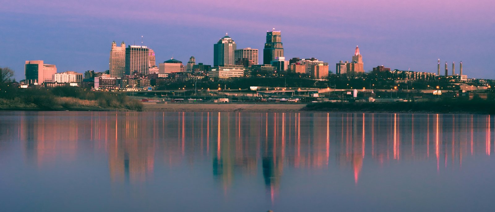 Kansas City skyline at sunset over the Missouri River